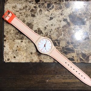 Water resistant watch with orange stitching